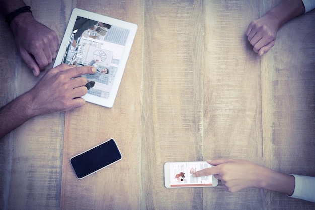 A split image showing two hands, one holding a magnifying glass over a ballot paper, the other using a smartphone to research political information.
