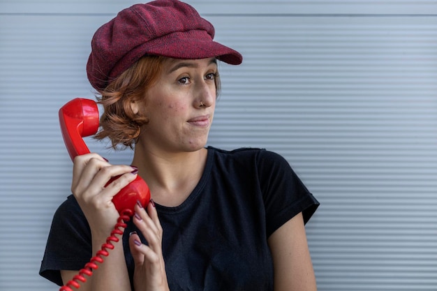 A close-up of a volunteer making phone calls to potential voters from a campaign office, with a headset on and a determined expression.
