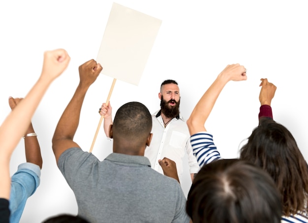 A diverse group of people standing in line to vote, with some holding signs supporting third-party candidates. The atmosphere is energetic and reflects increased civic engagement.