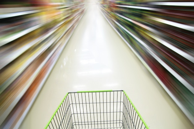 A split image contrasting a grocery cart filled with goods in 2019 with the same cart containing fewer items in 2024, both labeled with respective price totals reflecting inflation's impact on consumer purchasing power.