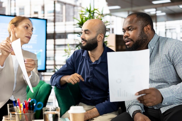 A diverse group of professionals in a meeting, discussing compliance and the implications of the new rules, symbolizing the need for collaboration and proactive planning.