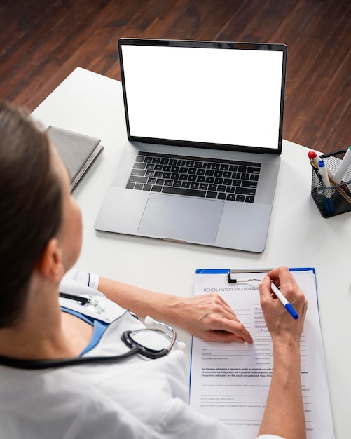 A person sitting at a desk, filling out a Medicaid application form on a laptop with a friendly and clear user interface. The scene is well-lit, conveying ease and accessibility in the enrollment process.