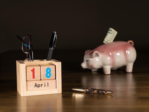 A piggy bank filled with coins, with a calendar in the background showing the year 2025, to represent saving and planning for SSI benefits.