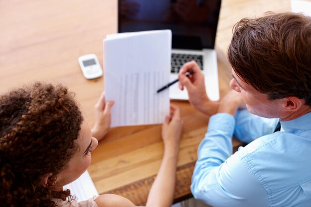 A parent filling out an application form for a Child Care Assistance Program, highlighting the paperwork and documentation involved in the process.
