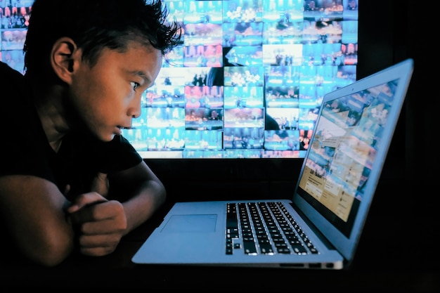A person using a laptop to report suspected fraud online, with various government agency logos displayed on the screen to represent the different reporting channels.
