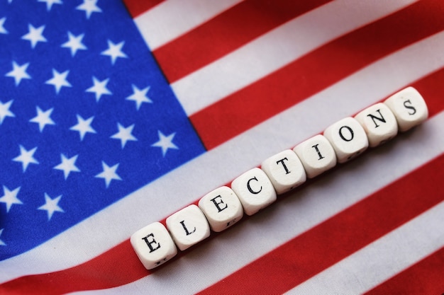 An American flag waving in the background with a voter registration form in the foreground, symbolizing the importance of civic duty.