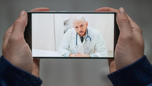 A split screen showing a doctor providing a virtual consultation on one side and a patient comfortably engaging from their home on the other side. The image emphasizes the convenience and accessibility of telehealth, with a focus on patient-centered care.