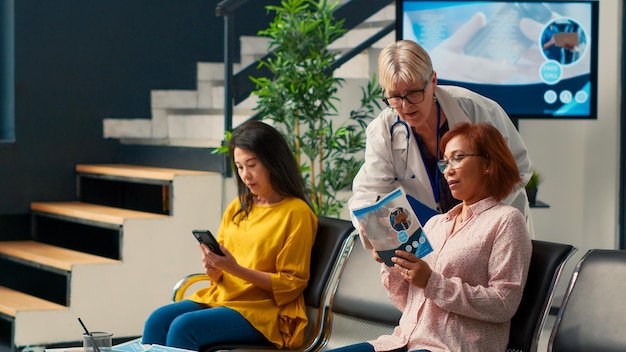 A family looking at a tablet, discussing healthcare expenses and HSA contributions, representing family healthcare planning.